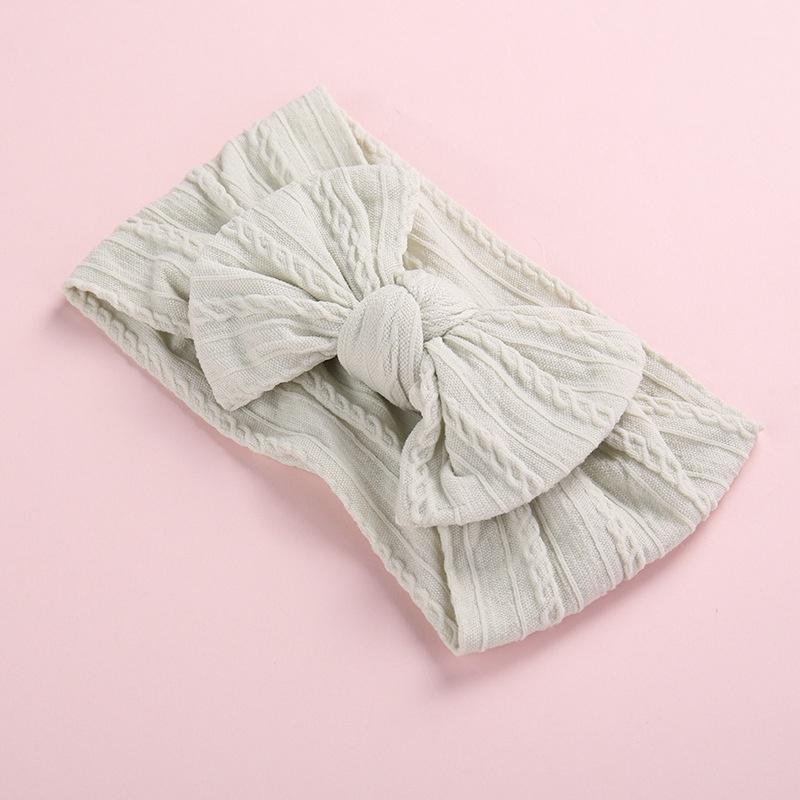 Tiara com decoração de laço para bebê menina