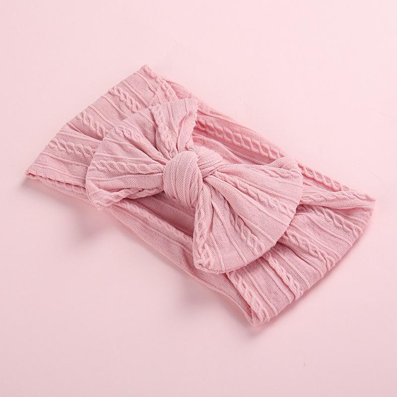 Tiara com decoração de laço para bebê menina